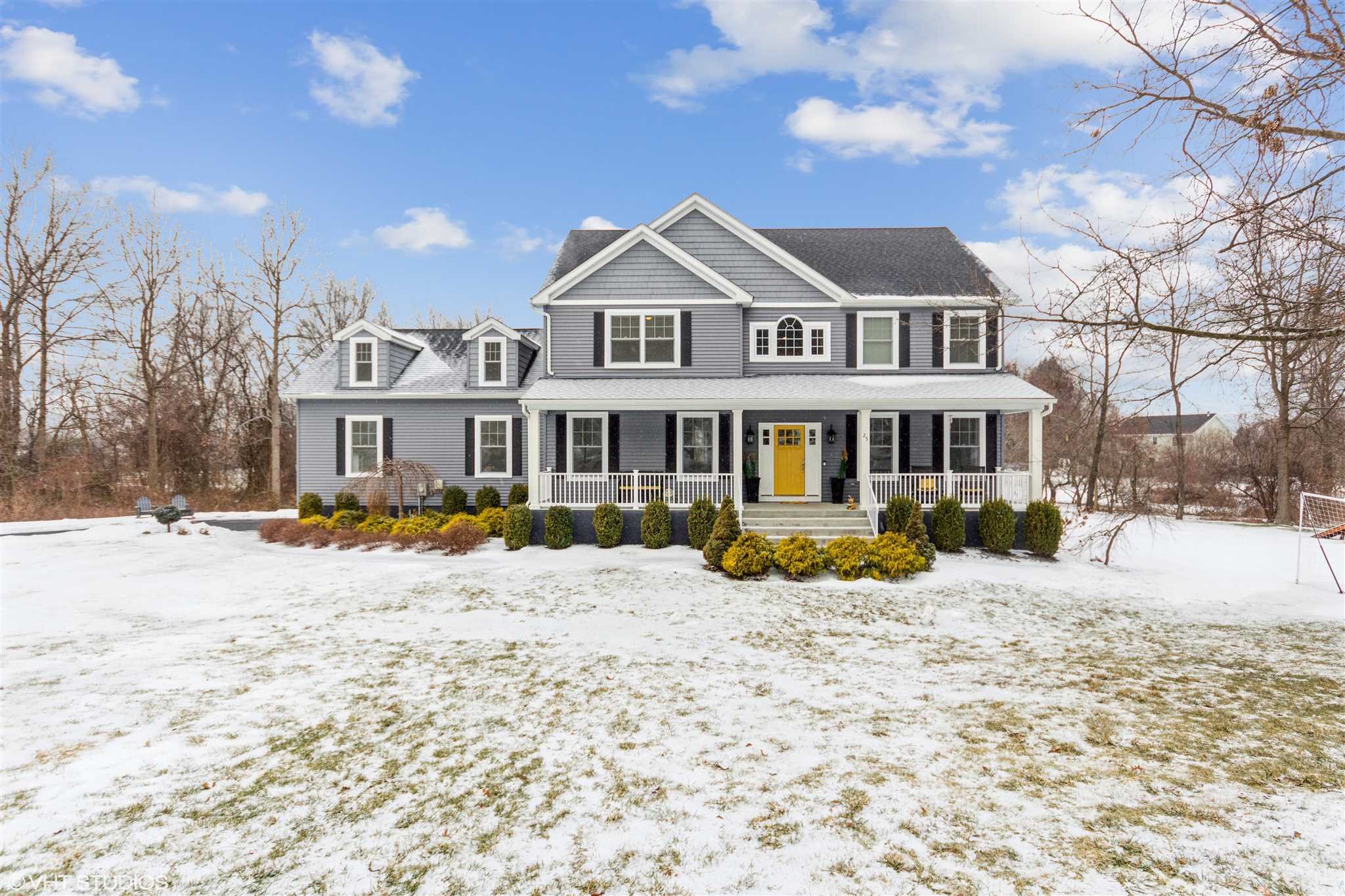 25 Riding Ridge Trail Beacon, NY 12508 - Photo 2 of 25 a front view of a house with a yard covered with snow