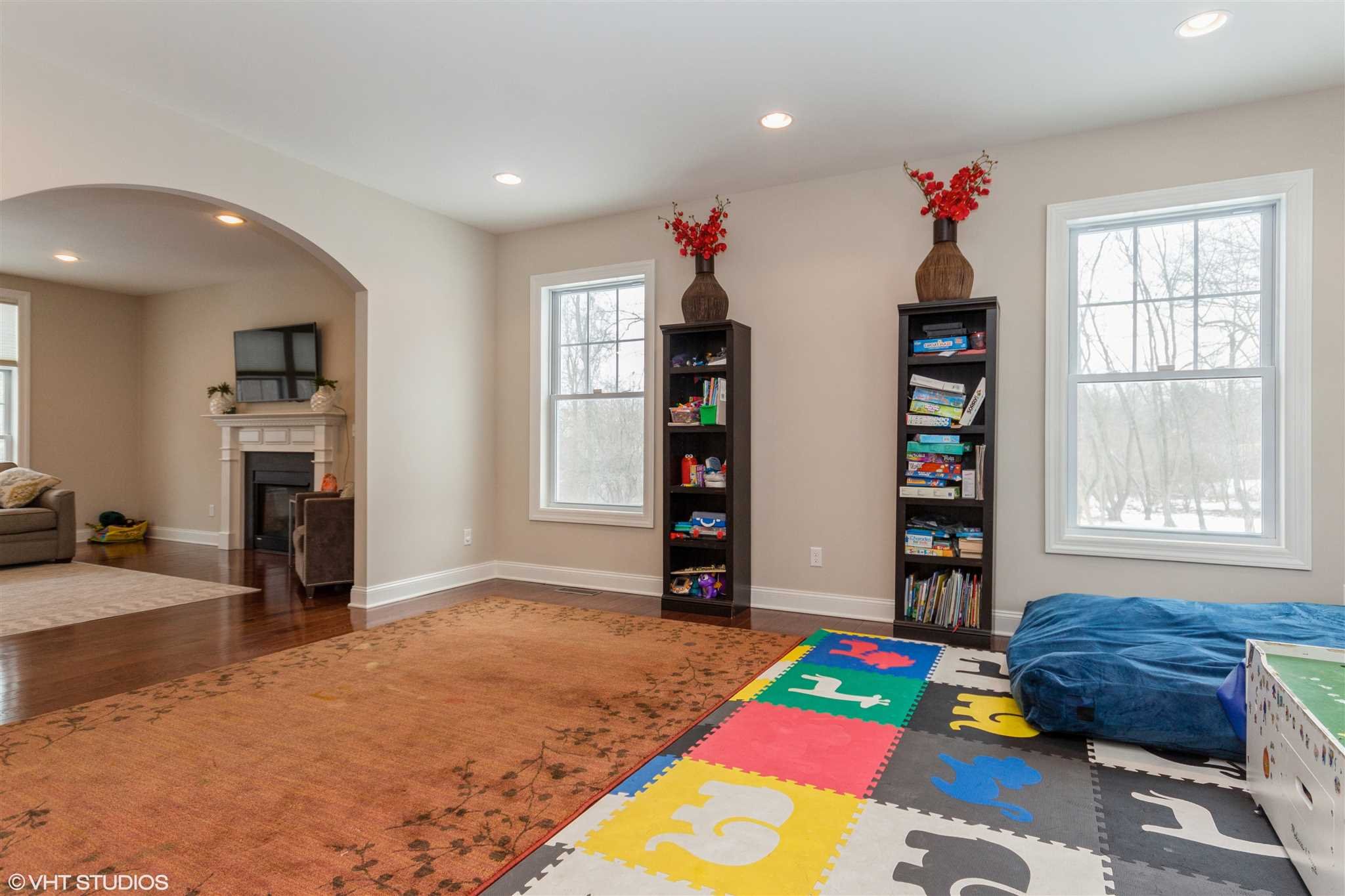 25 Riding Ridge Trail Beacon, NY 12508 - Photo 4 of 25 a living room with furniture and a book shelf