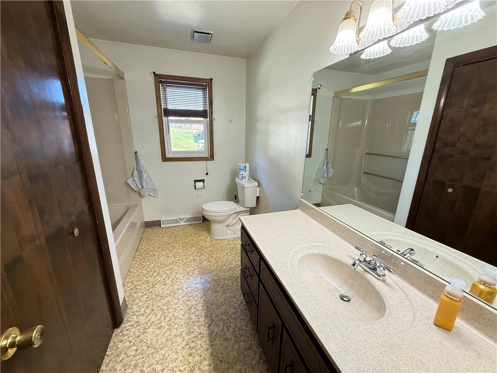 18 Water Street Smithfield, PA 15478 - Photo 14 of 26 a bathroom with a sink a toilet and vanity