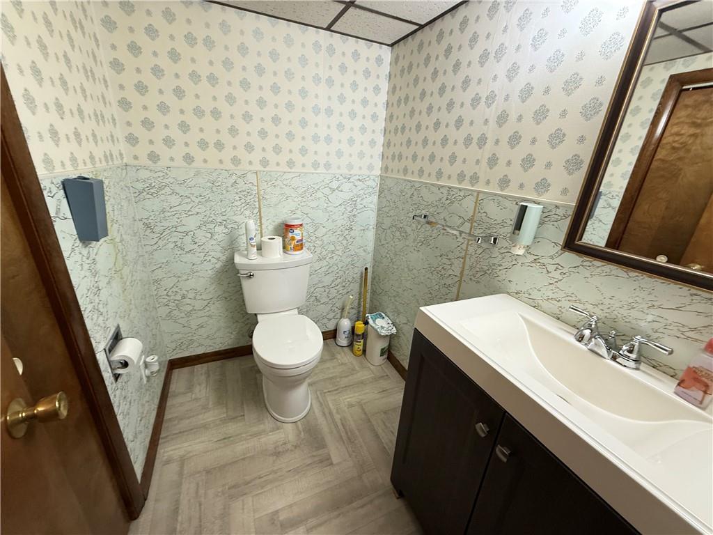 18 Water Street Smithfield, PA 15478 - Photo 15 of 26 a bathroom with a sink a toilet a mirror and shower