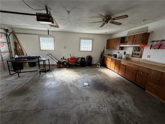 a kitchen with sink cabinets and window