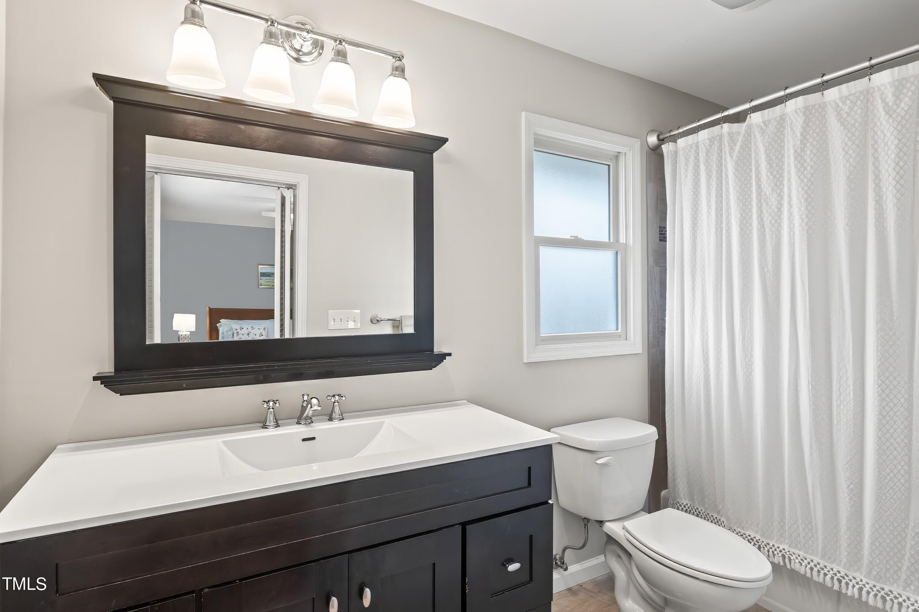 528 Harvard Street Raleigh, NC 27609 - Photo 15 of 44 Ensuite Primary Bathroom
