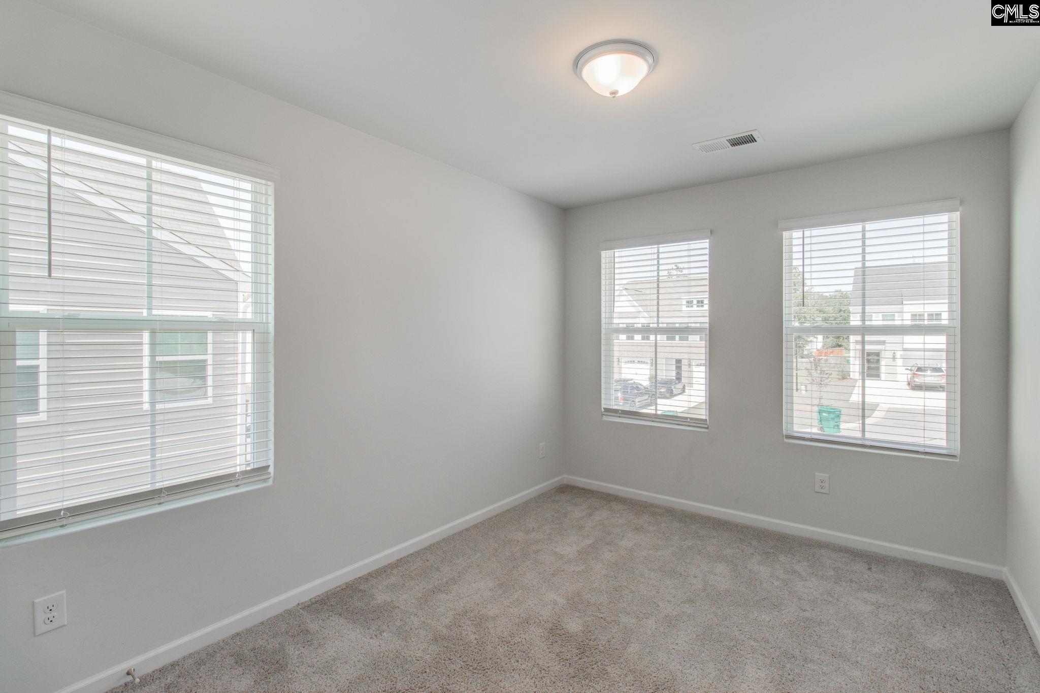 312 Reedmace Court Lexington, SC 29072 - Photo 21 of 29 an empty room with a window