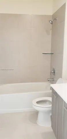 a bathroom with a toilet a sink and a bathtub