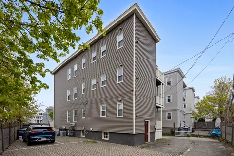 a view of multiple house with a street