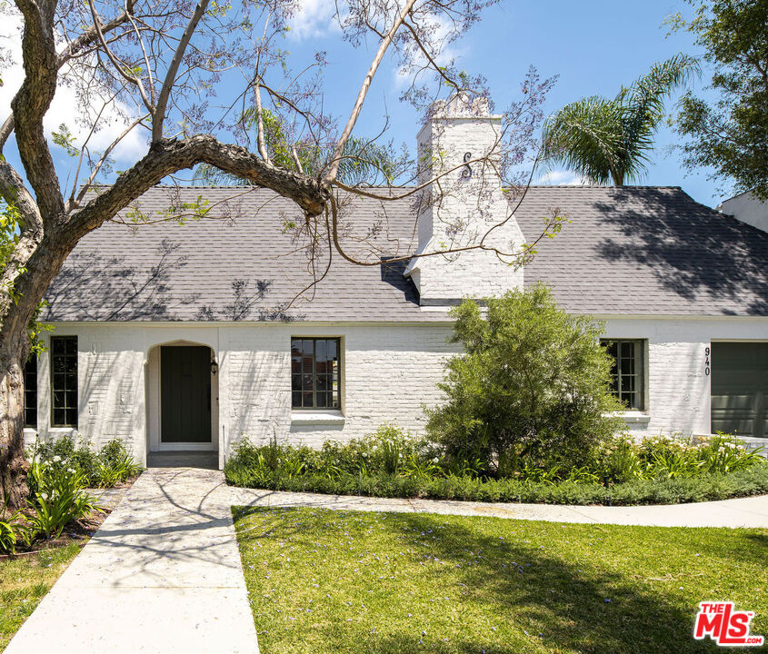 940 Hauser Boulevard Los Angeles, CA 90036 - Photo 1 of 53 a front view of a house with a garden and yard