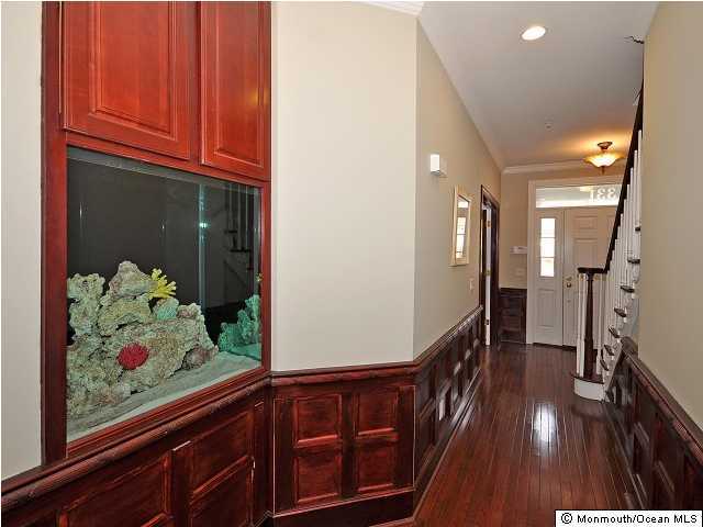 331 Park Avenue Rutherford, NJ 07070 - Photo 2 of 3 a view of a hallway with wooden floor and staircase