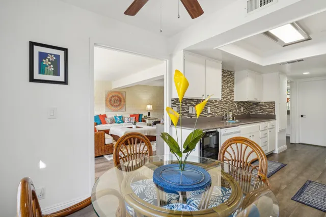 a kitchen with stainless steel appliances a sink and a refrigerator