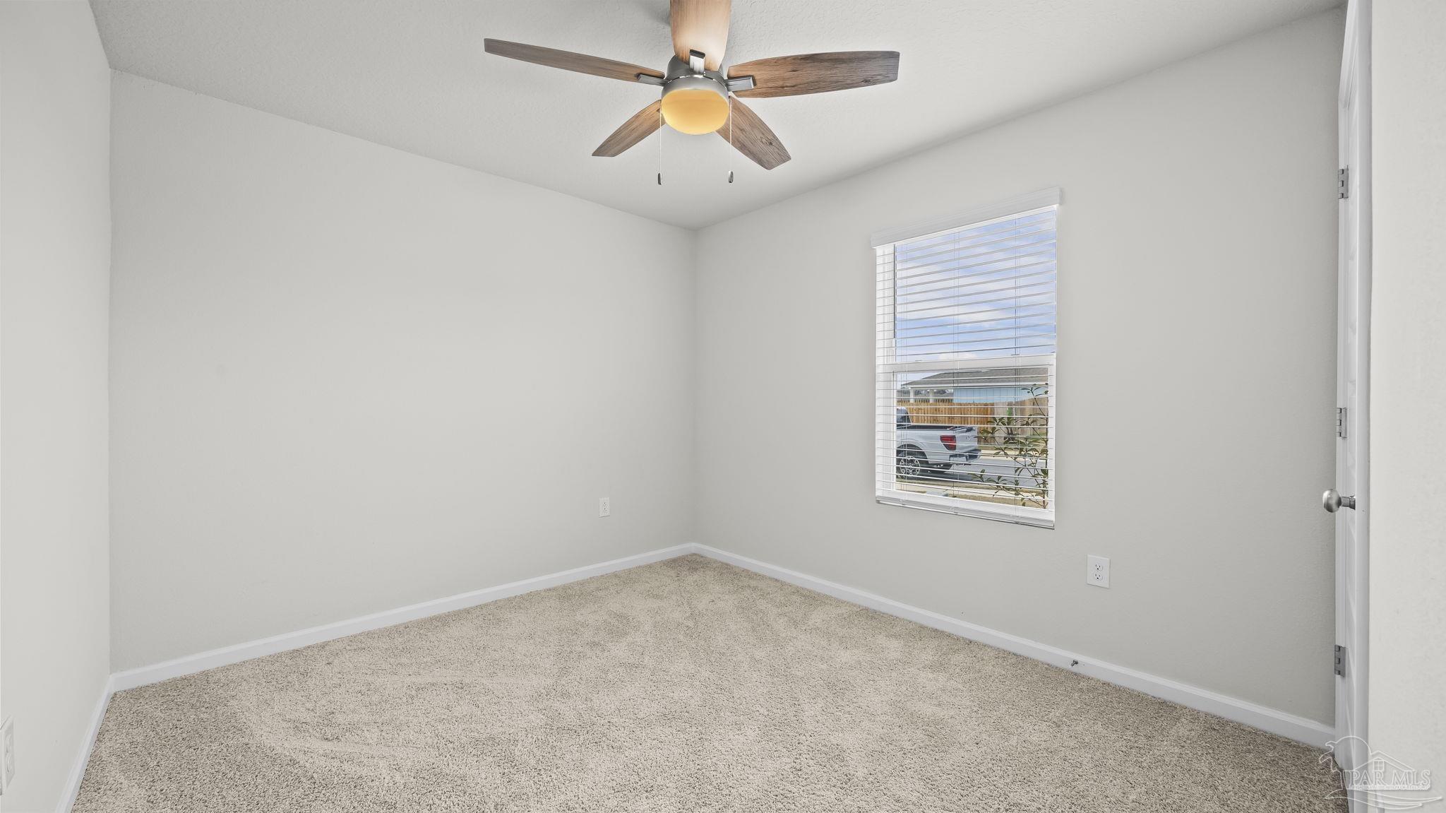 22483 Aleutian Avenue Foley, AL 36535 - Photo 19 of 27 an empty room with windows and fan