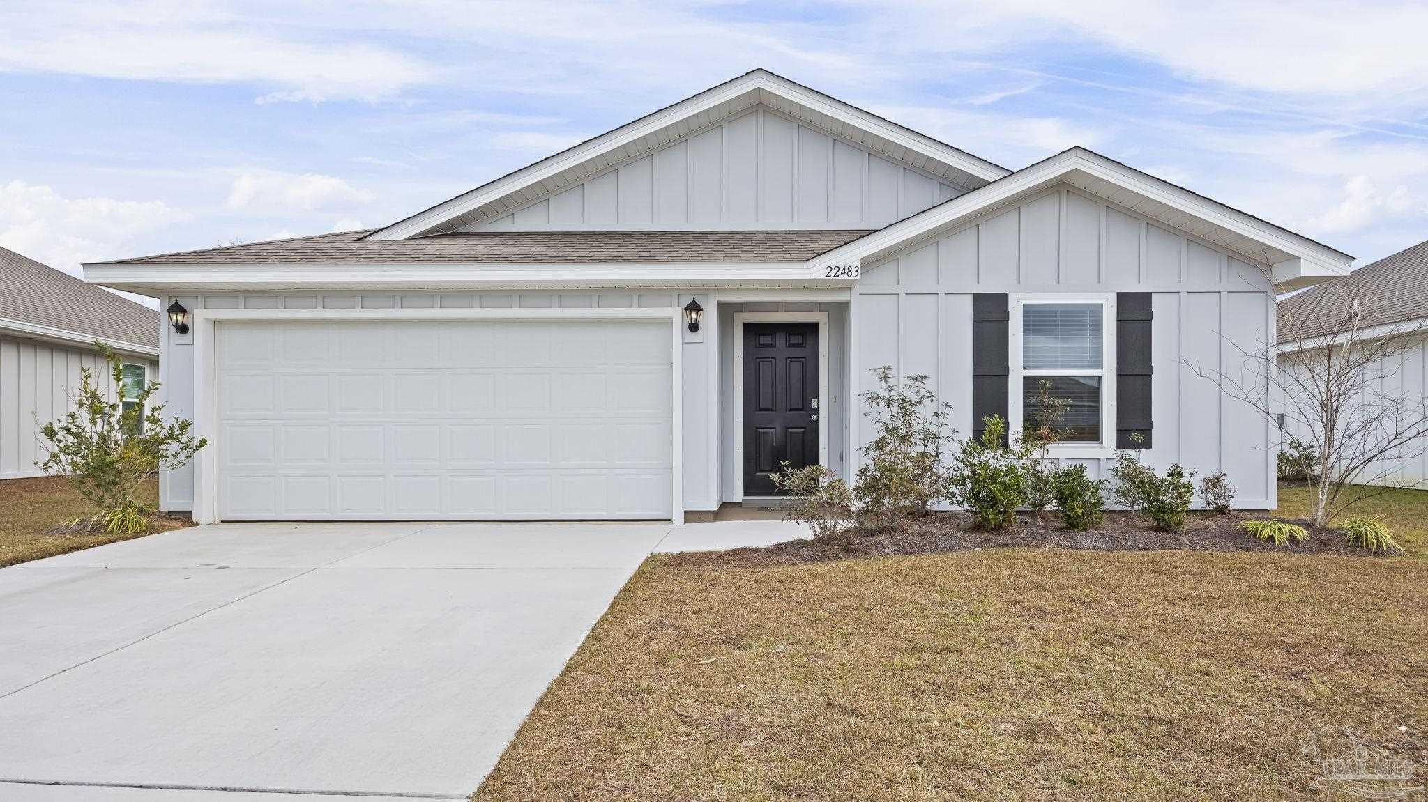 22483 Aleutian Avenue Foley, AL 36535 - Photo 2 of 27 a front view of a house with garden