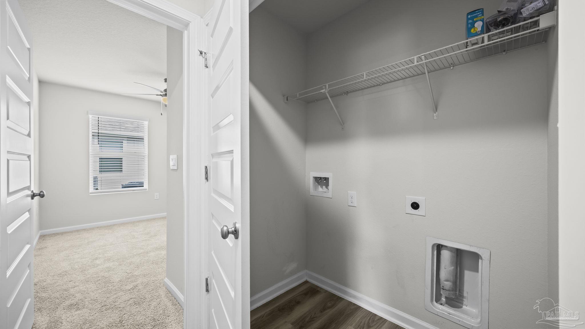 22483 Aleutian Avenue Foley, AL 36535 - Photo 21 of 27 a view of a hallway with wooden floor and closet