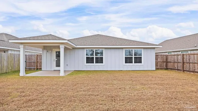 a view of a yard with an outdoor seating