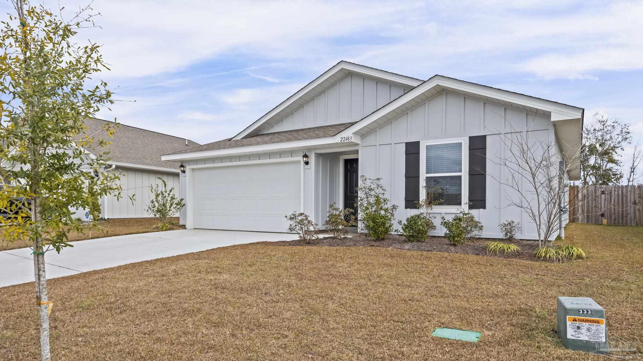 22483 Aleutian Avenue Foley, AL 36535 - Photo 3 of 27 front view of a house with a yard