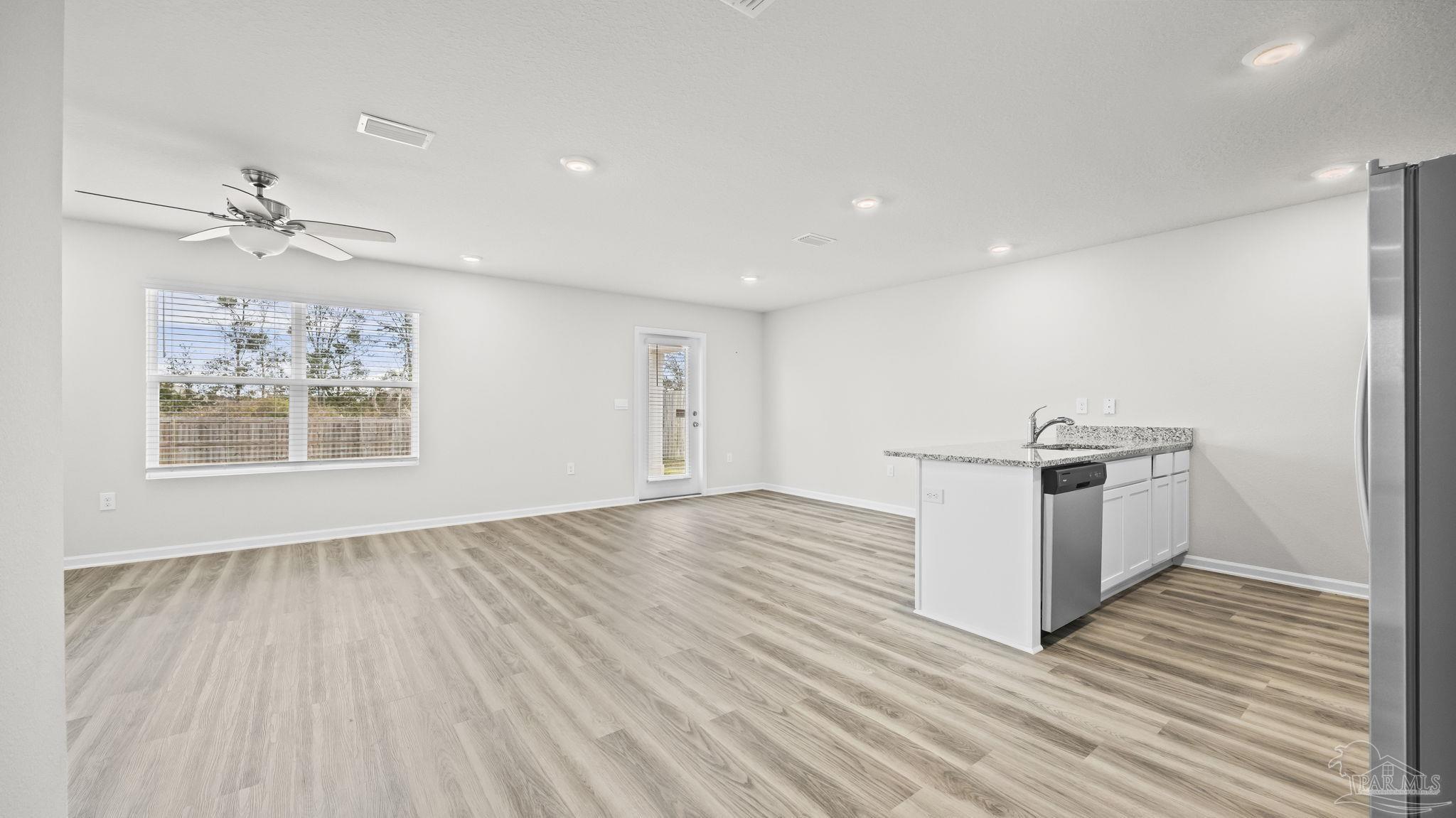 22483 Aleutian Avenue Foley, AL 36535 - Photo 6 of 27 wooden floor in an empty room with a window