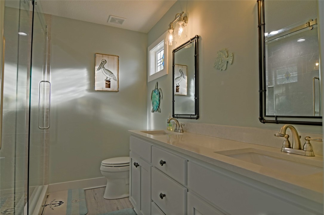 1102 White Street Fernandina Beach, FL 32034 - Photo 12 of 32 a bathroom with a sink toilet and shower