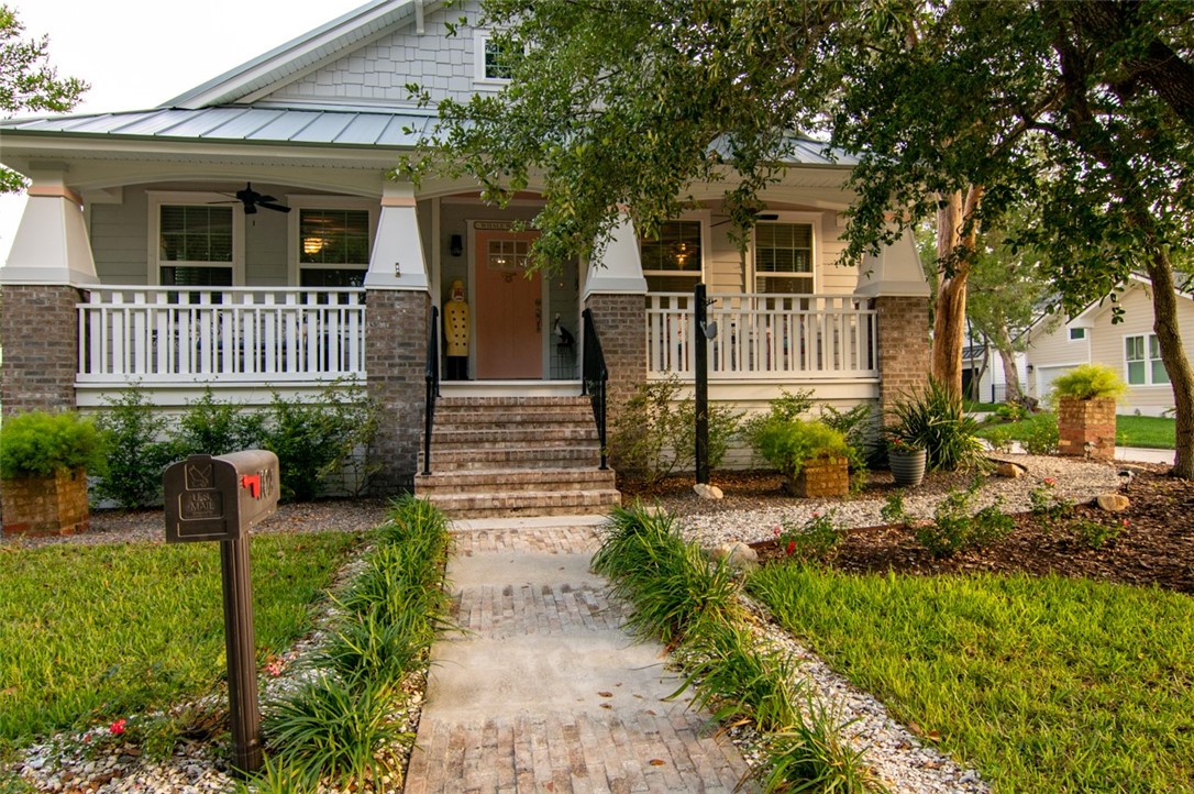 1102 White Street Fernandina Beach, FL 32034 - Photo 26 of 32 a front view of a house with garden
