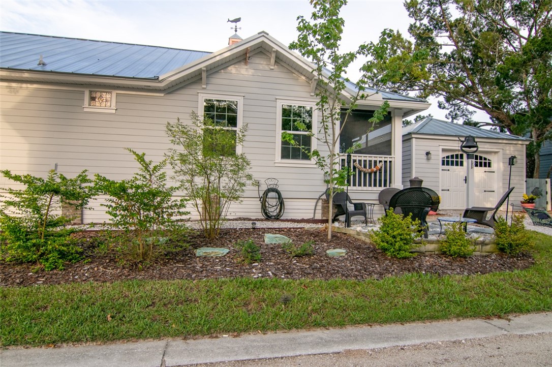 1102 White Street Fernandina Beach, FL 32034 - Photo 28 of 32 a front view of a house with garden