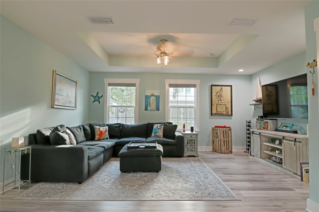1102 White Street Fernandina Beach, FL 32034 - Photo 6 of 32 a living room with furniture and a flat screen tv