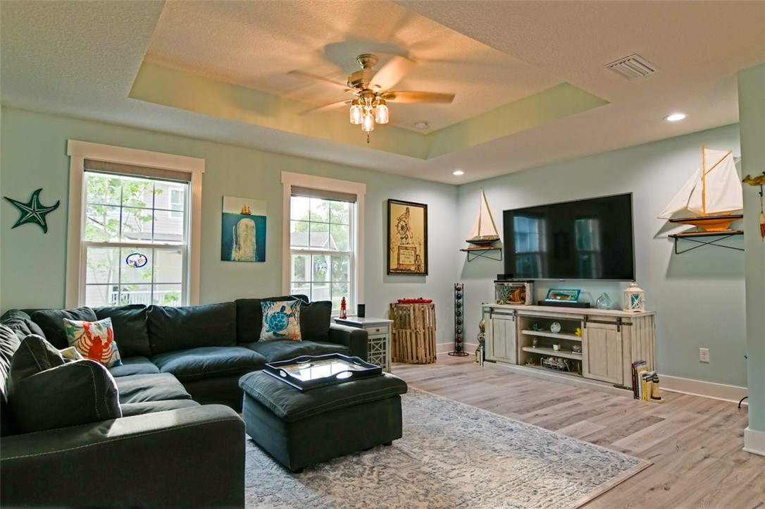 1102 White Street Fernandina Beach, FL 32034 - Photo 7 of 32 a living room with furniture and a flat screen tv