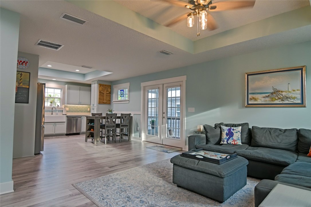 1102 White Street Fernandina Beach, FL 32034 - Photo 8 of 32 a living room with furniture and a chandelier