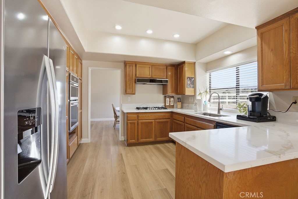 2680 Kashmere Canyon Road Acton, CA 93510 - Photo 13 of 60 a kitchen with a sink a counter top space stainless steel appliances and cabinets
