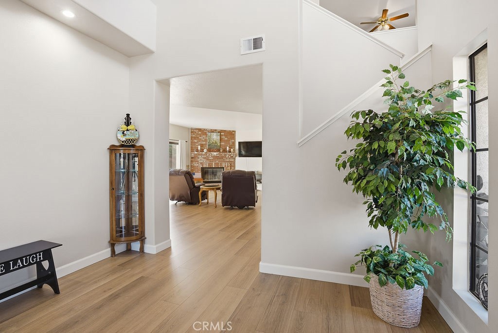 2680 Kashmere Canyon Road Acton, CA 93510 - Photo 16 of 60 a view of a hallway with wooden floor and a potted plant