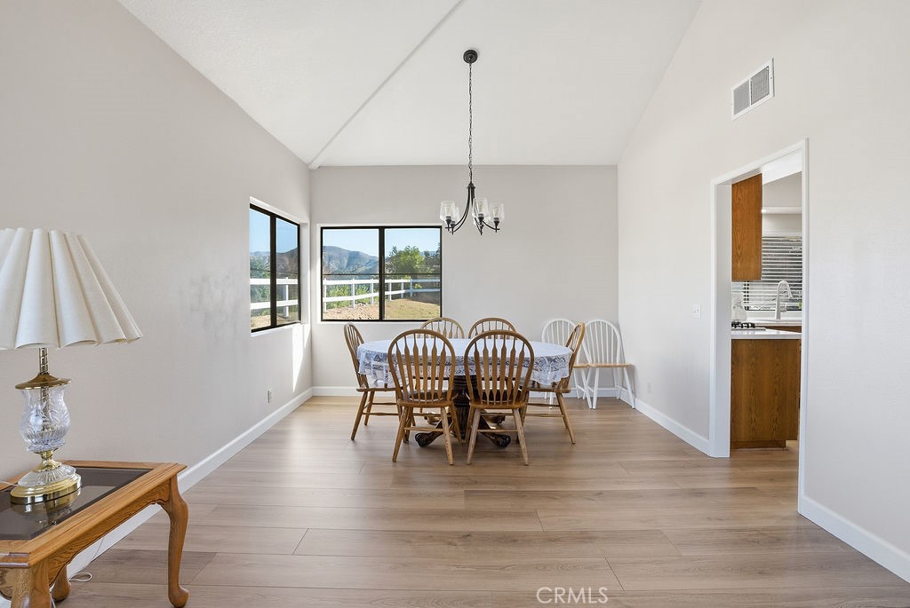 2680 Kashmere Canyon Road Acton, CA 93510 - Photo 17 of 60 a view of a dining room with furniture window and wooden floor