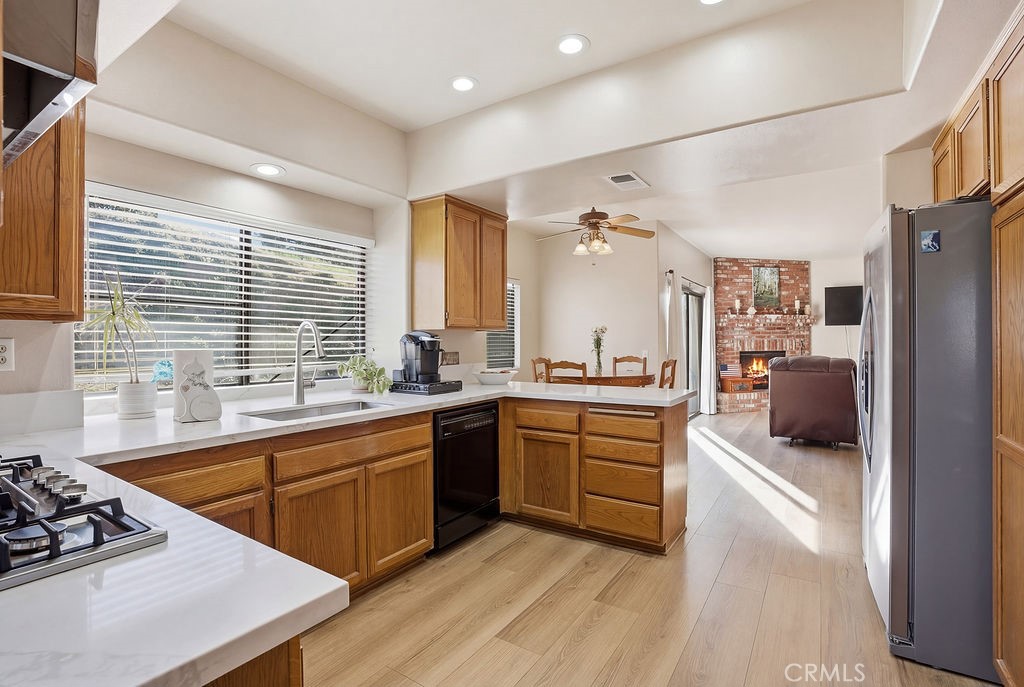 2680 Kashmere Canyon Road Acton, CA 93510 - Photo 18 of 60 a large kitchen with cabinets wooden floor and stainless steel appliances