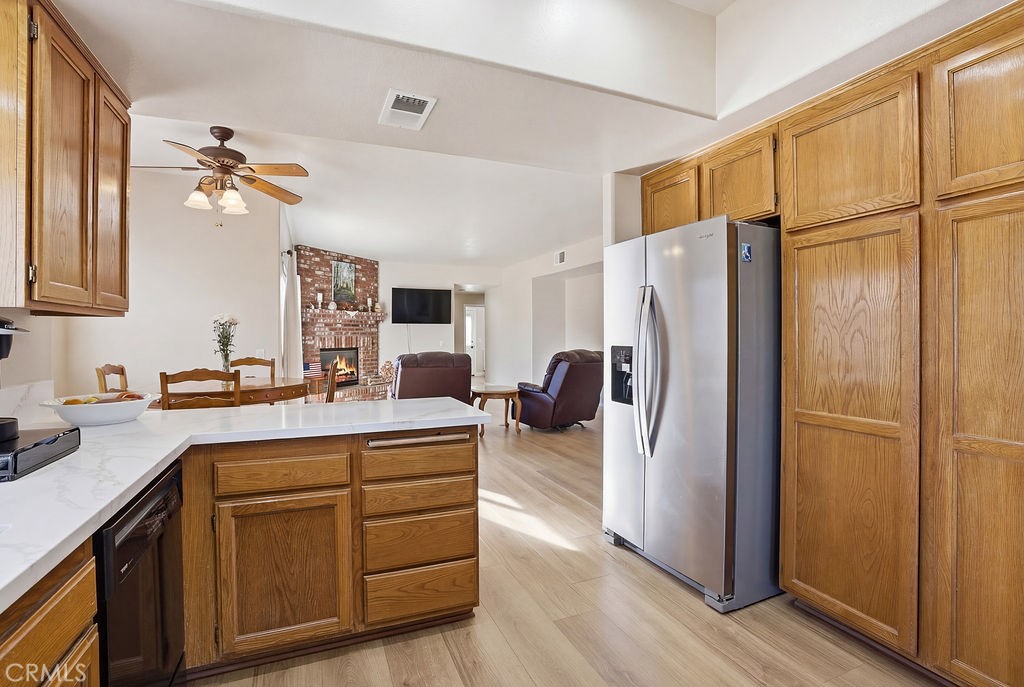 2680 Kashmere Canyon Road Acton, CA 93510 - Photo 19 of 60 a kitchen with a refrigerator a sink and cabinets