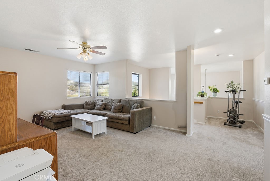 2680 Kashmere Canyon Road Acton, CA 93510 - Photo 24 of 60 a living room with furniture and a chandelier