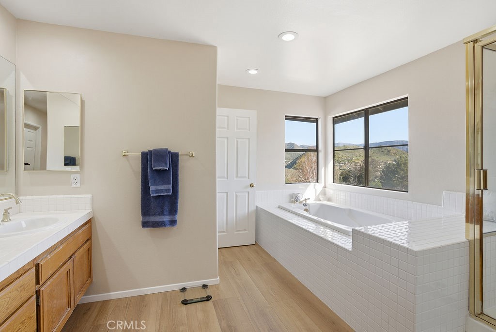 2680 Kashmere Canyon Road Acton, CA 93510 - Photo 28 of 60 a spacious bathroom with a tub sink and mirror