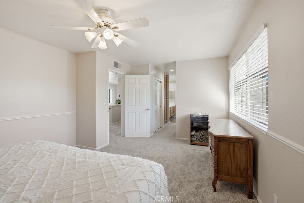 2680 Kashmere Canyon Road Acton, CA 93510 - Photo 30 of 60 a bedroom with a bed and a chandelier