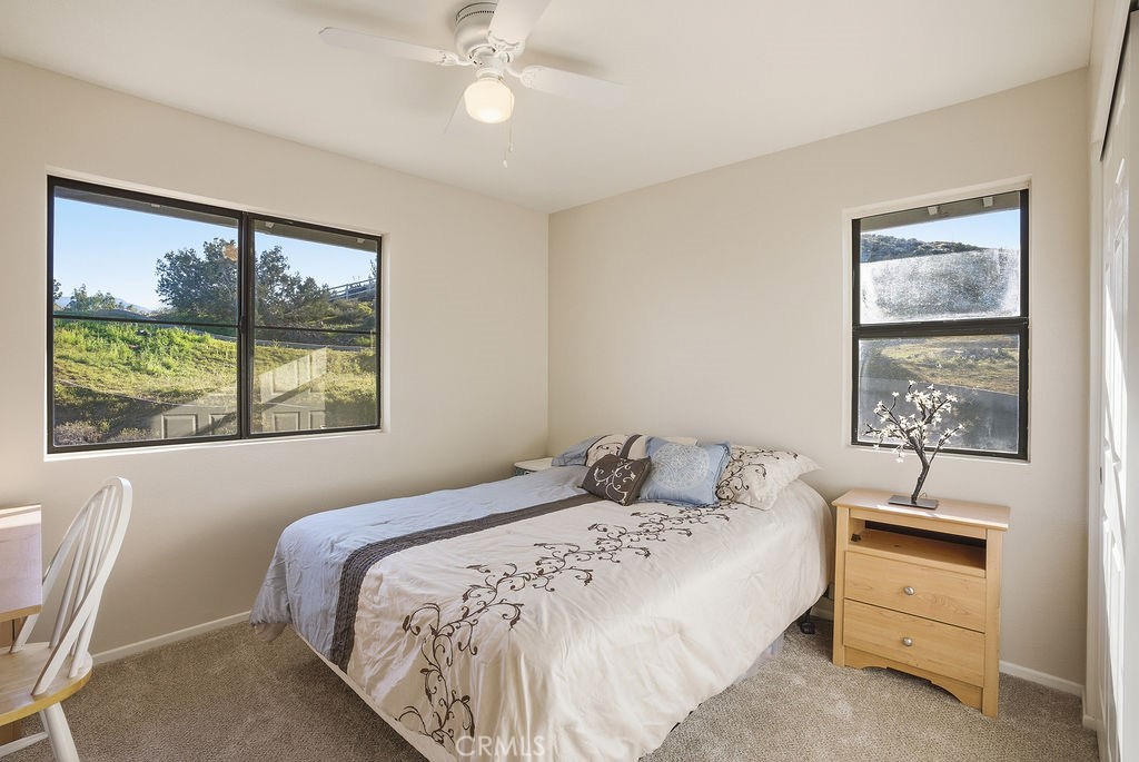 2680 Kashmere Canyon Road Acton, CA 93510 - Photo 35 of 60 a bedroom with a bed and a painting on the wall