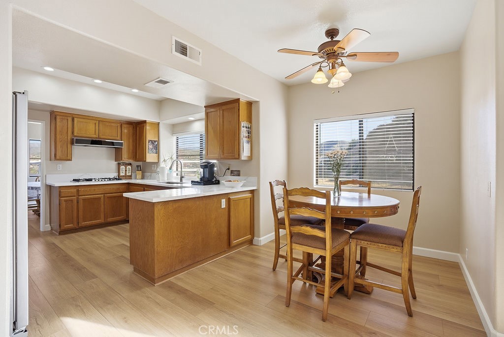 2680 Kashmere Canyon Road Acton, CA 93510 - Photo 44 of 60 a kitchen with a table chairs sink and cabinets
