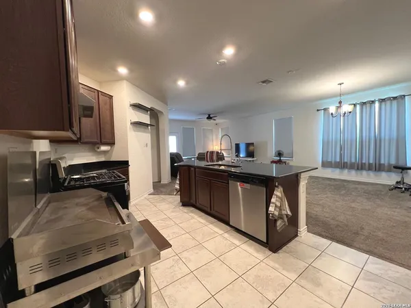 a large kitchen with stainless steel appliances