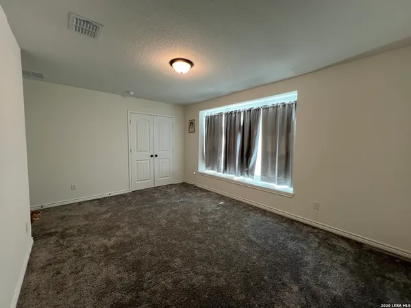 a view of an empty room with window