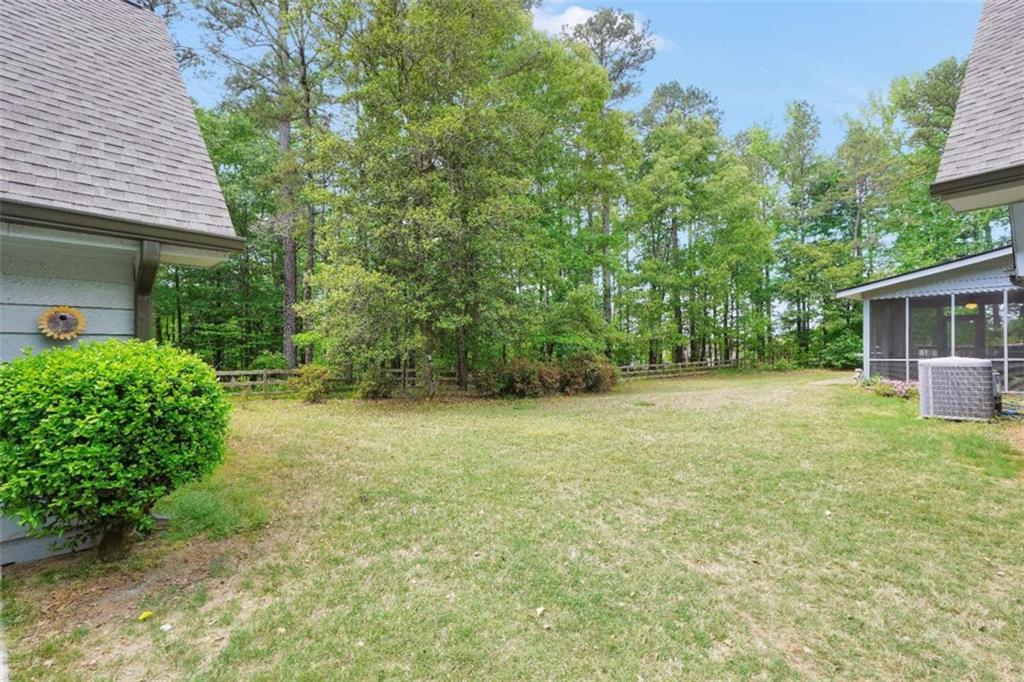 314 Winding Stream Trail Southwest Conyers, GA 30094 - Photo 51 of 59 a view of a backyard with a garden