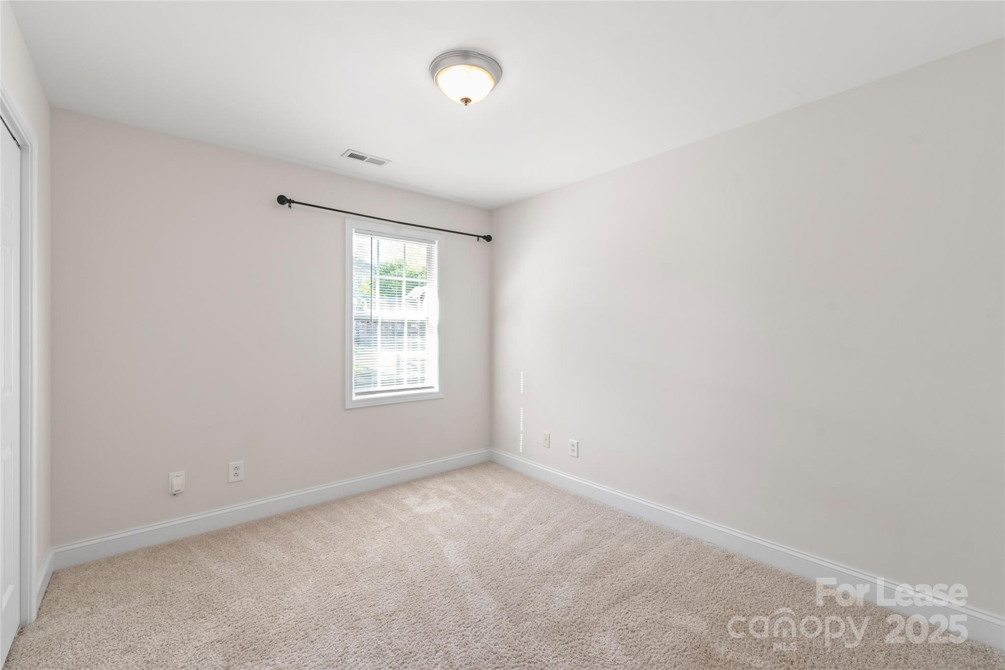 3007 Laurel Creek Lane Monroe, NC 28110 - Photo 17 of 28 an empty room with windows