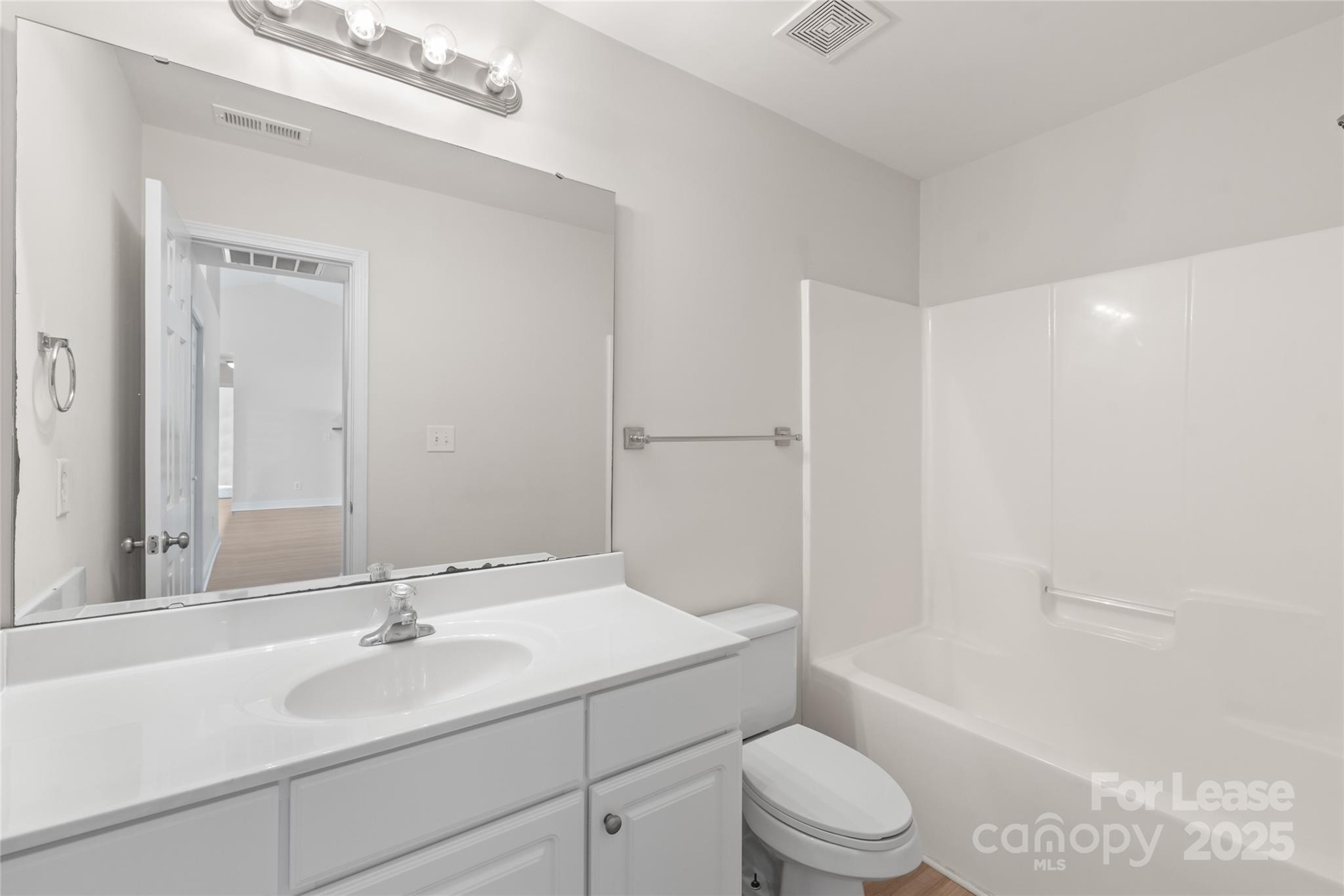 3007 Laurel Creek Lane Monroe, NC 28110 - Photo 19 of 28 a bathroom with a sink a toilet and shower