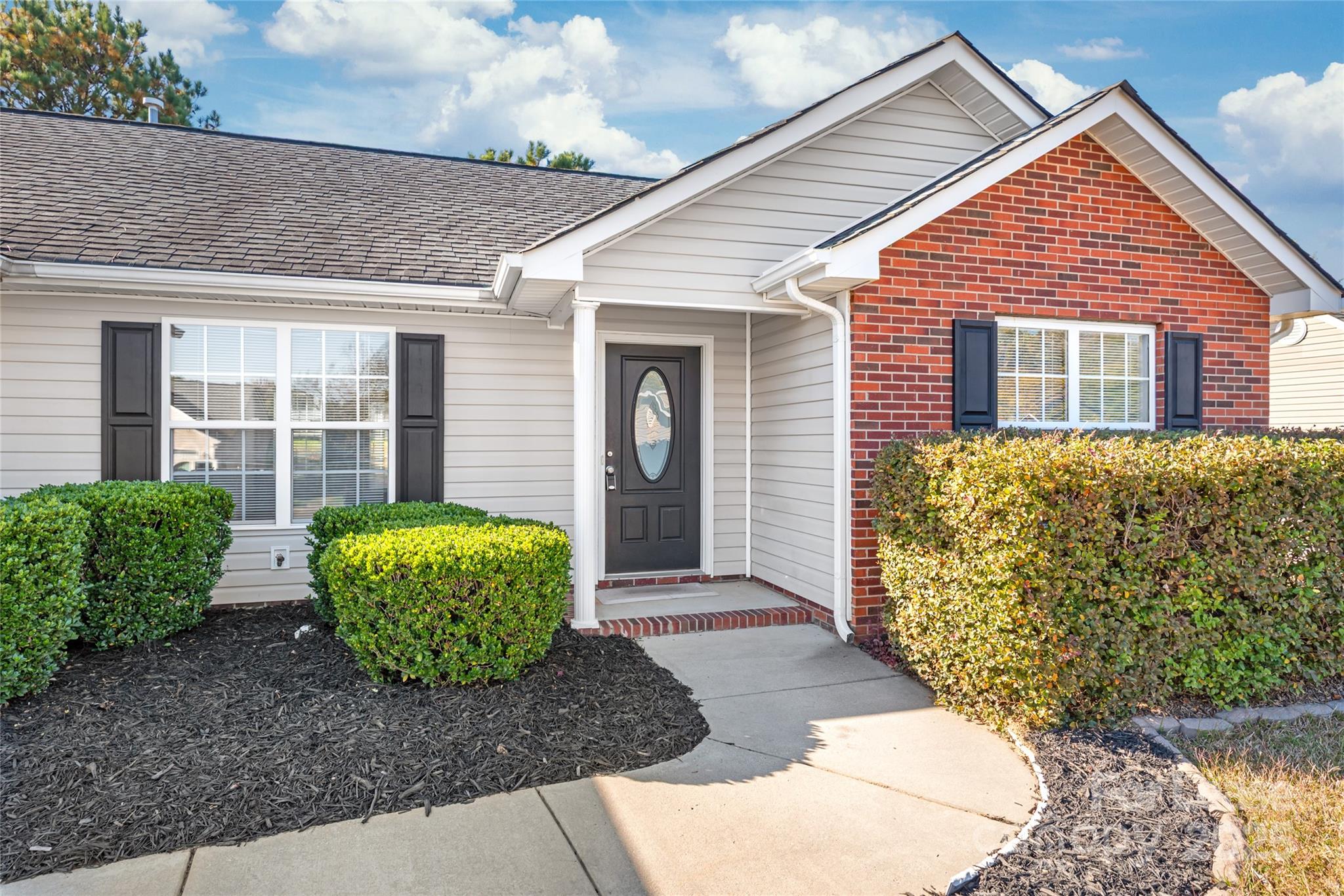 3007 Laurel Creek Lane Monroe, NC 28110 - Photo 2 of 28 a front view of a house with garden