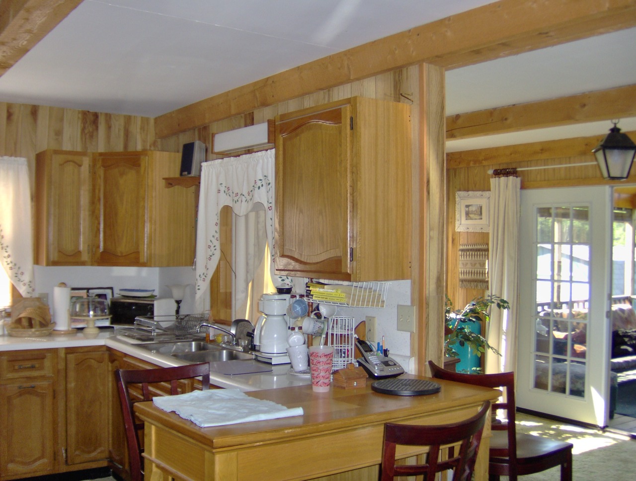 92 Access Road 3 Road, Unit 3 Plainfield, MA 01070 - Photo 11 of 19 a kitchen with a sink stove and cabinets