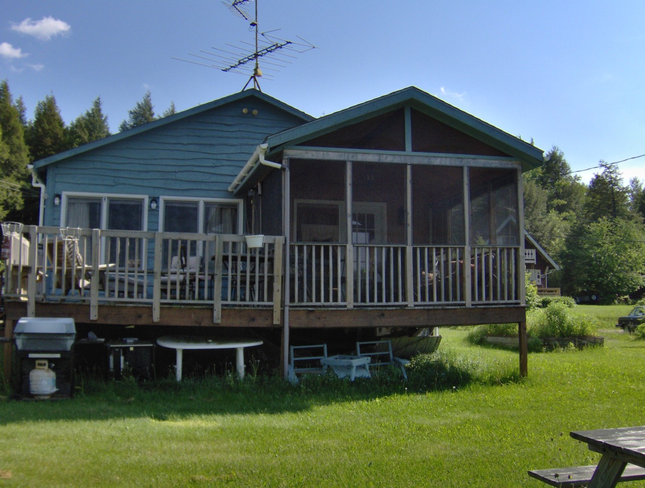 92 Access Road 3 Road, Unit 3 Plainfield, MA 01070 - Photo 18 of 19 a view of a house with a deck and a yard