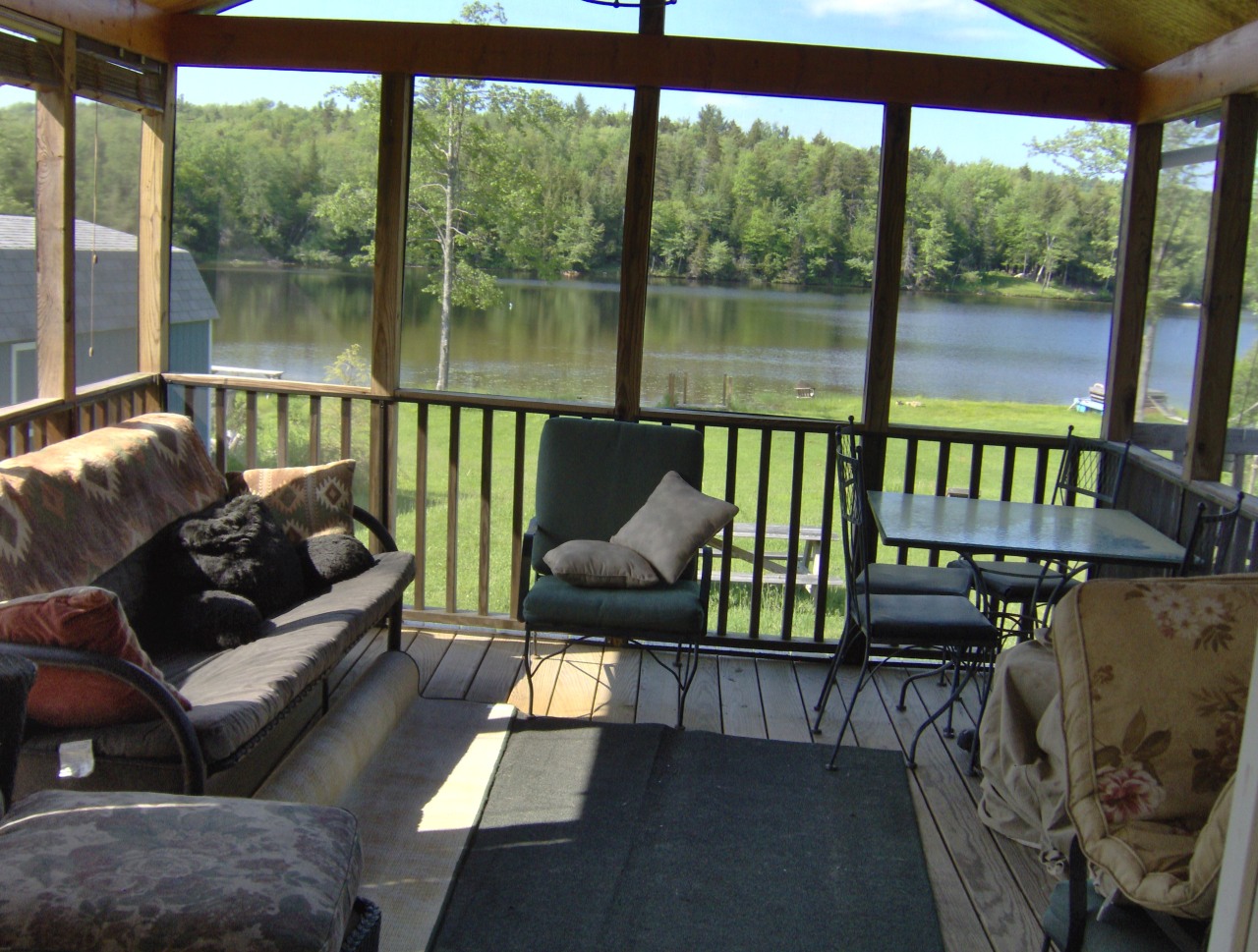 92 Access Road 3 Road, Unit 3 Plainfield, MA 01070 - Photo 6 of 19 a balcony with couch and outdoor view