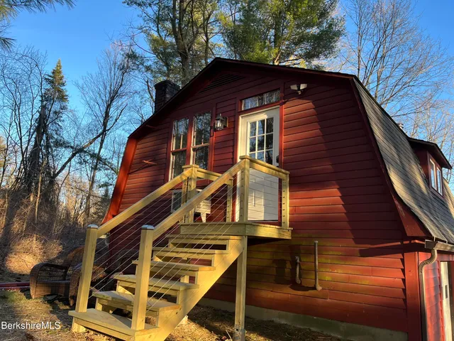 a front view of house with a trees