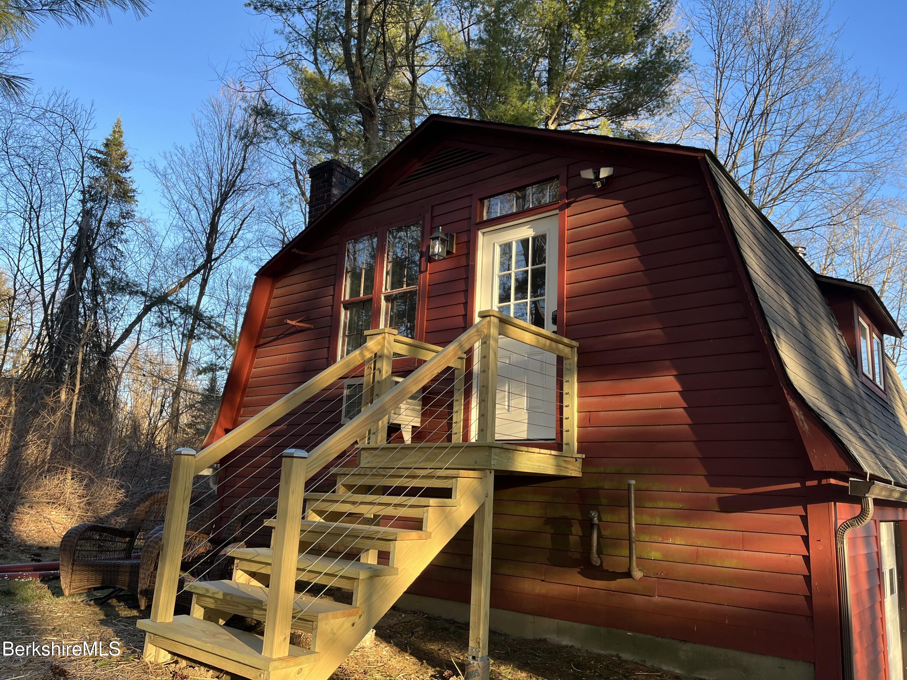 a front view of house with a trees