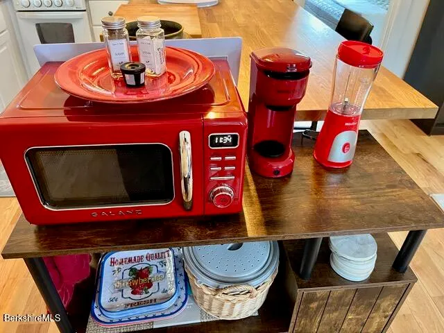a room with dining room and wooden floor