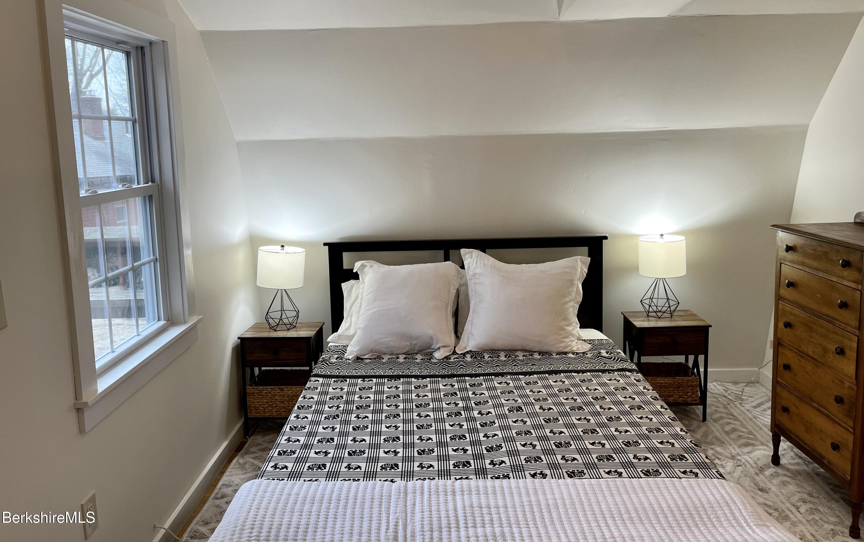 150 Water Farm Road Sheffield, MA 01257 - Photo 6 of 15 a bedroom with a large bed and a window
