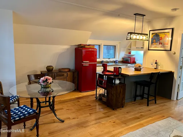 a work room with furniture and rug