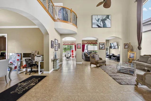 a living room with furniture and a gym