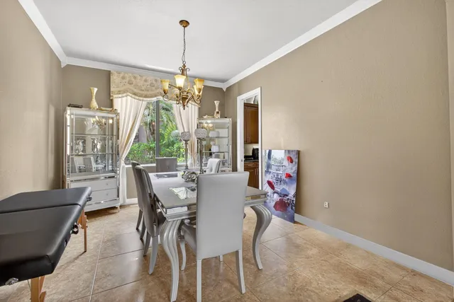 a bedroom with a bed window and a flat screen television